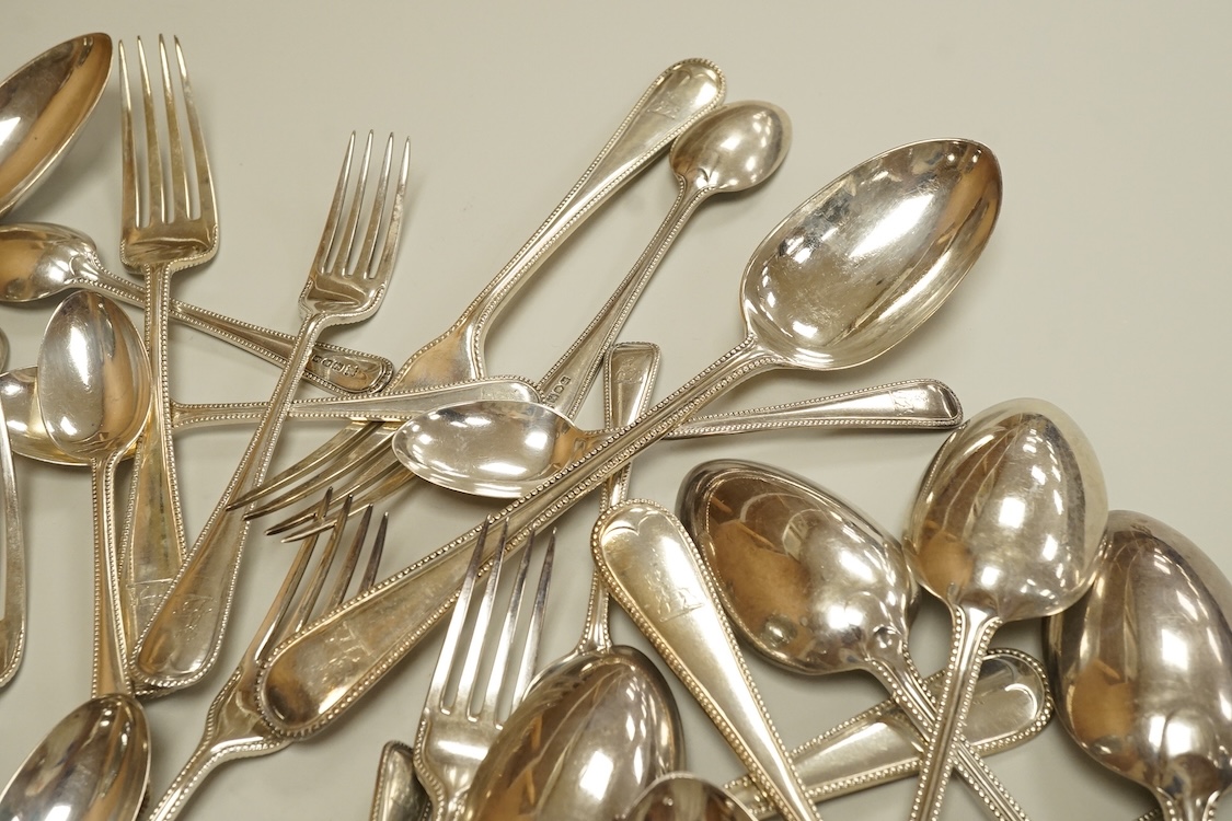 A harlequin part canteen of late Victorian and Edwardian silver beaded Old English pattern flatware, various dates and makers, comprising thirty items, 55.8oz.
